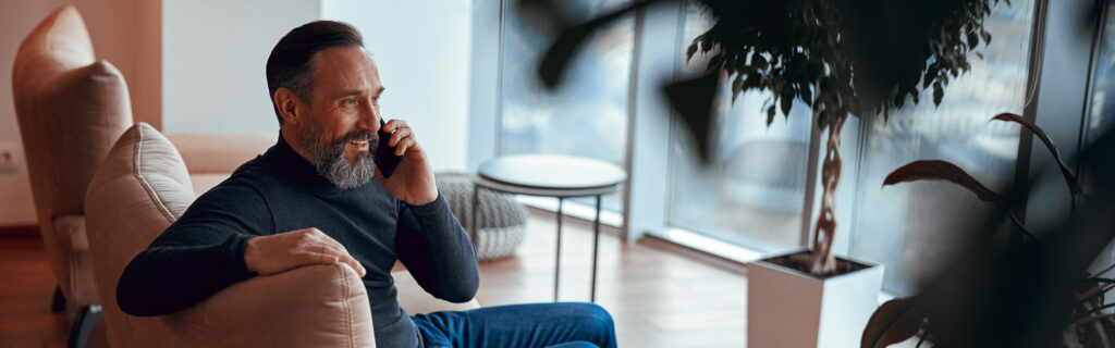 Happy Bearded Man Sitting Near Window And Chatting 2026 03 10 01 08 42 Utc 1024x320